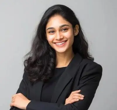 Professional headshot of a woman with curly hair